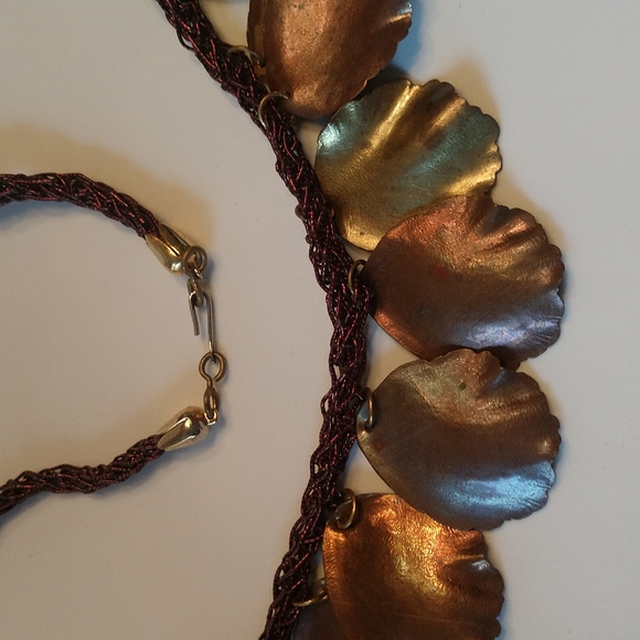 Sculpted metal petals on braided maroon cord necklace - Picture 3 of 3